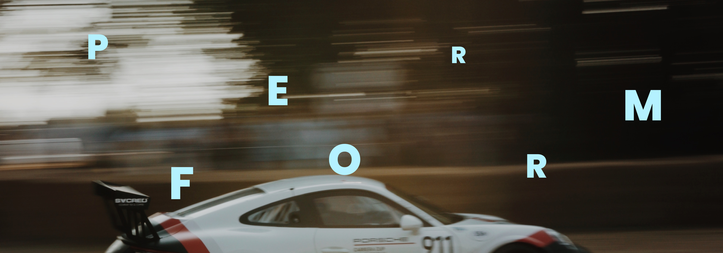 Image of a racing car with text displaying "perform" overlayed